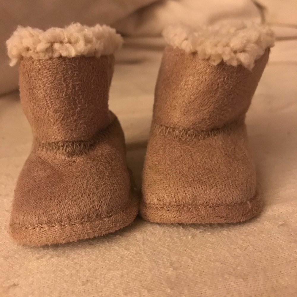 Brand new, never worn. Baby booties